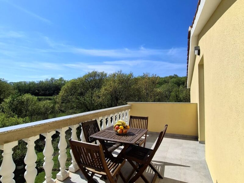 Four-bedroom apartment with a pool and fenced yard