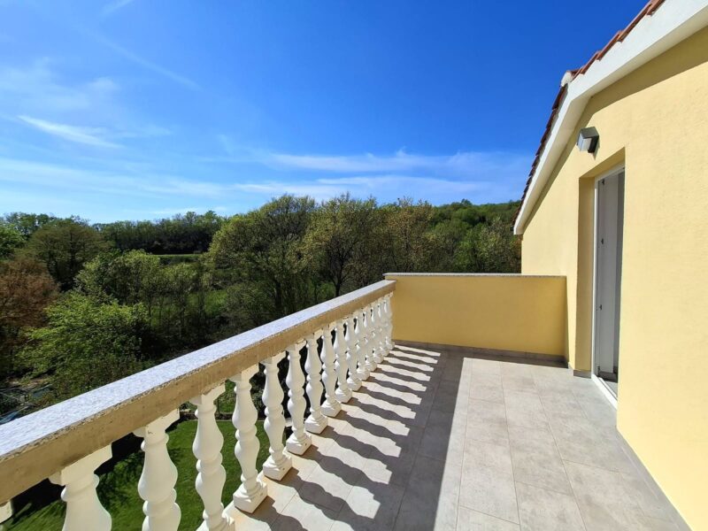 Four-bedroom apartment with a pool and fenced yard