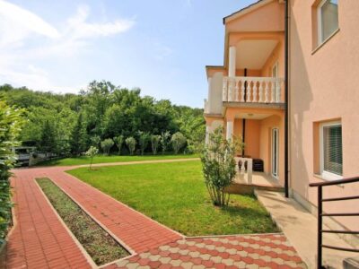 Spacious apartment with a pool and fenced yard